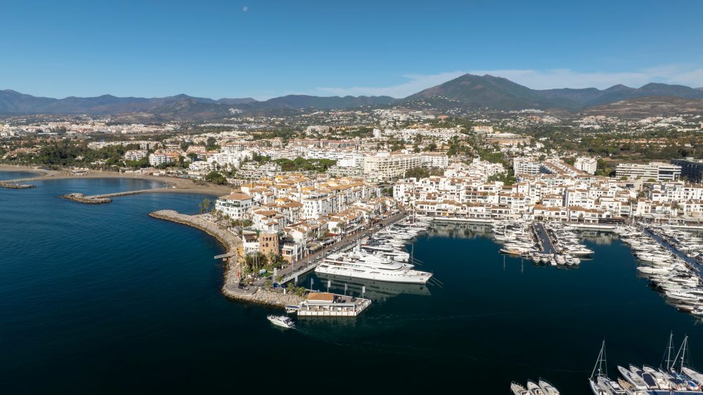 A flyover view of Puerto Banus a beautiful oceanside marina in spain.