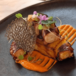 picture of an ikan seafood dish taken inside the restaurant