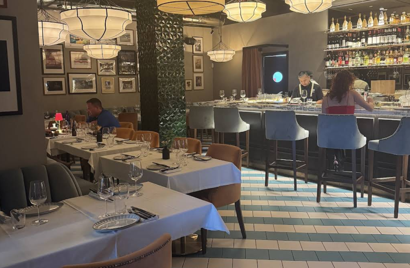 Picture taken looking at bar and tables inside beats marbella asian eatery