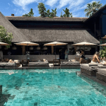 Fancy tropical vibe pool with sunbeds