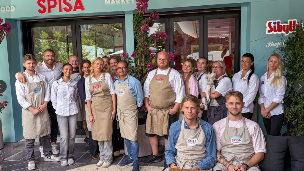 Team standing in front of Spisa foodmarket in Marbella