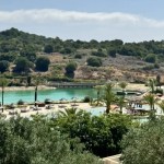 overview over a beachclub lagoon with trees