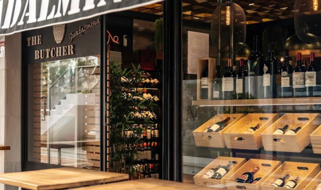 window into a butcher with meat and wine